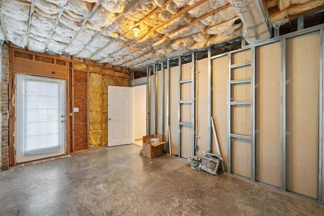 a view of a house with a yard and sitting area