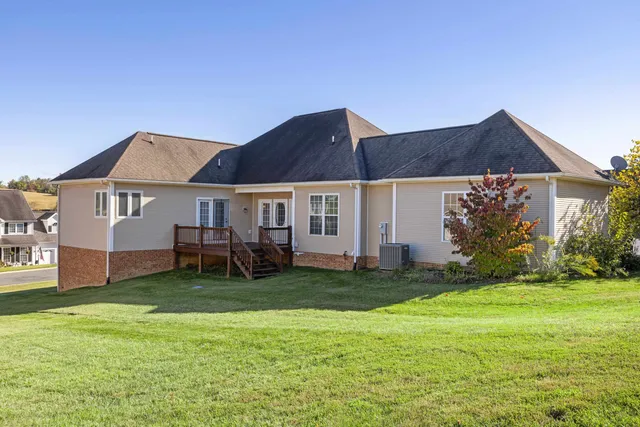 an aerial view of a house with yard swimming pool and outdoor seating