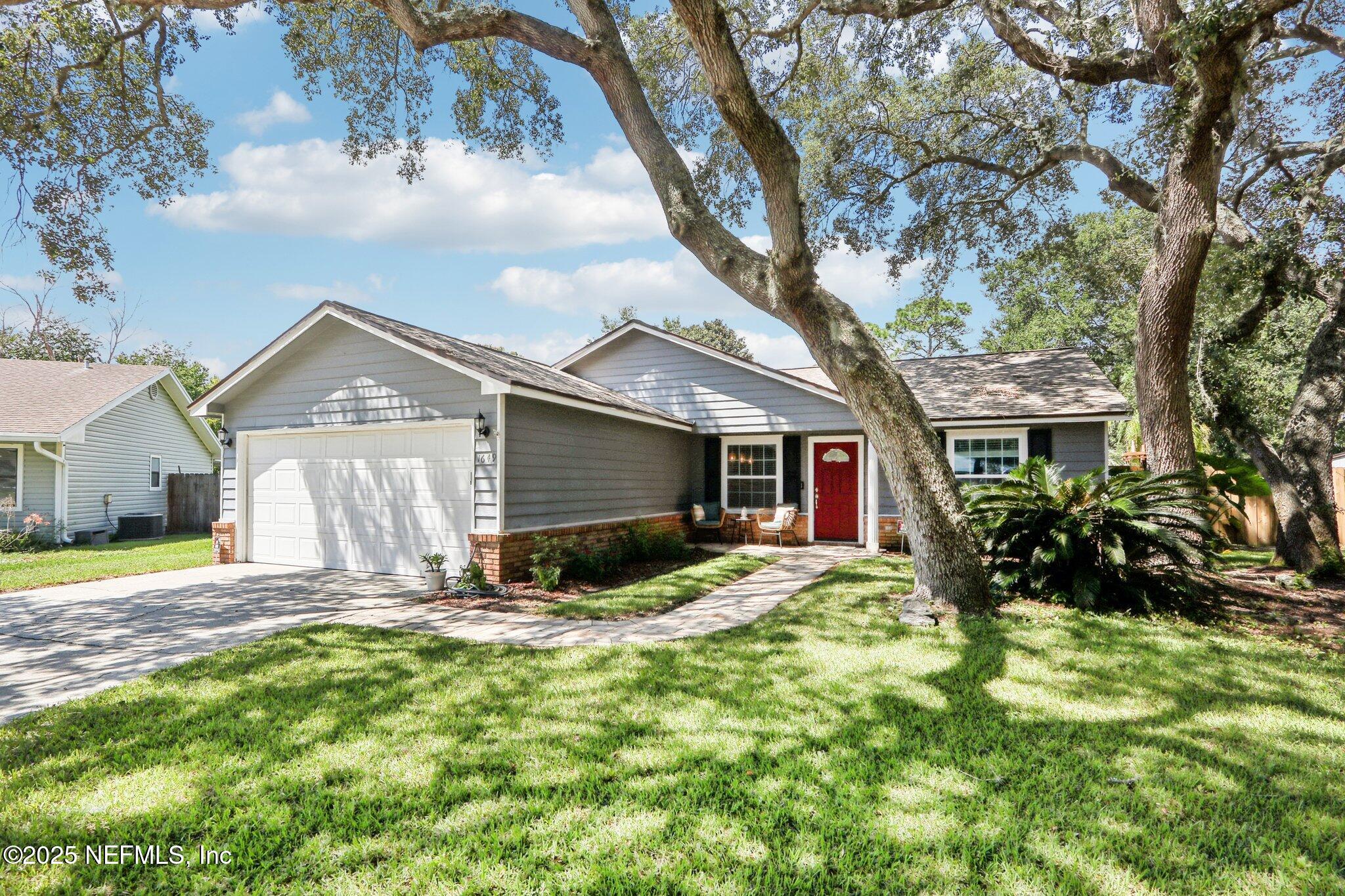 1649 Panther Ridge Court Jacksonville, FL 32225 - Photo 1 of 29 a house view with a garden space