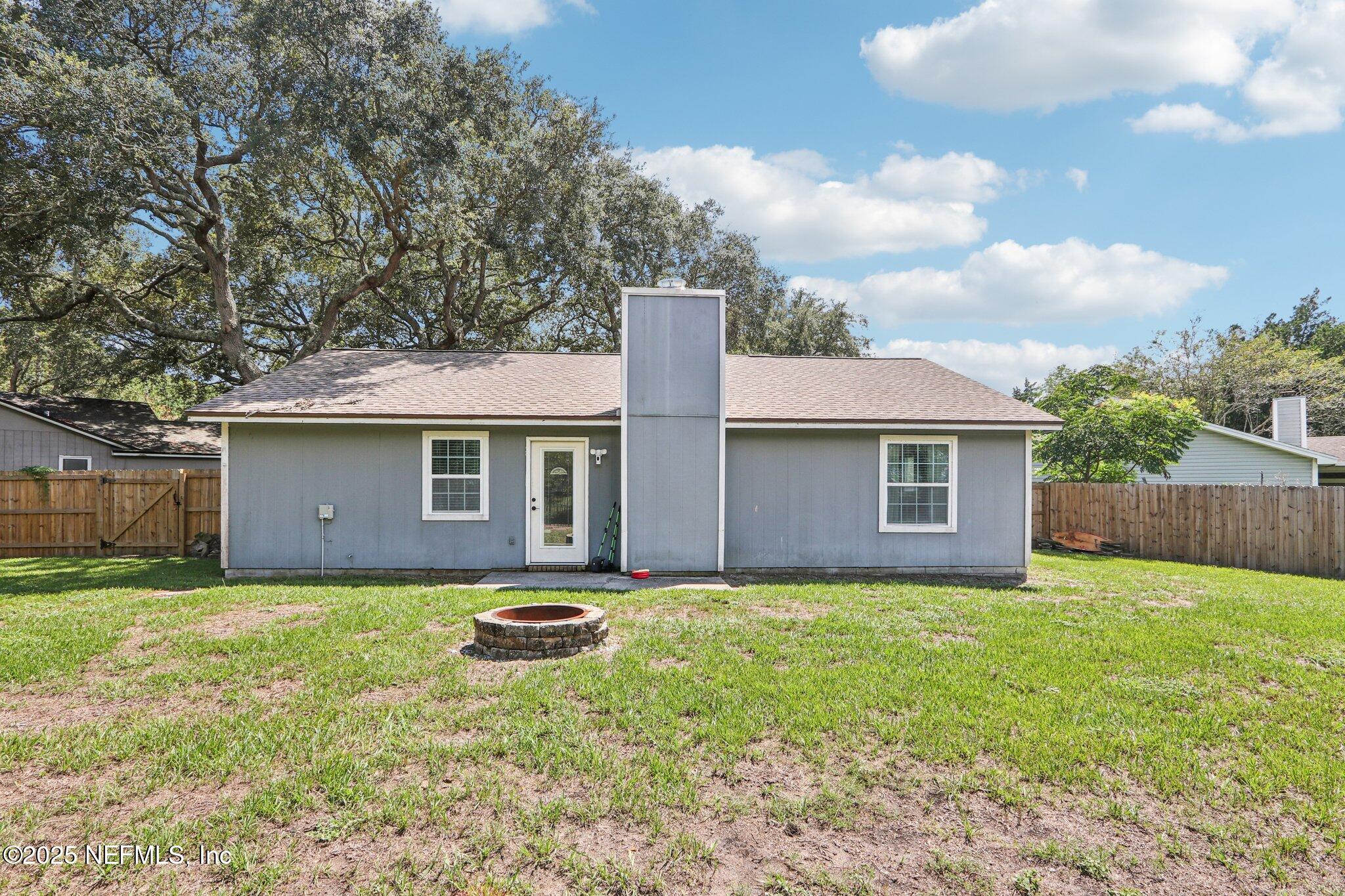 1649 Panther Ridge Court Jacksonville, FL 32225 - Photo 26 of 29 a view of a house with a yard and large tree
