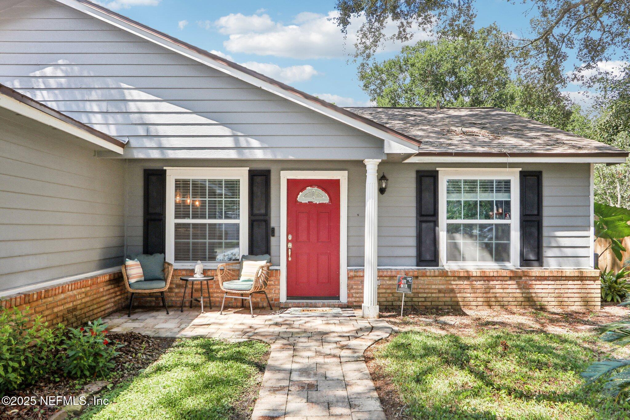 1649 Panther Ridge Court Jacksonville, FL 32225 - Photo 3 of 29 a front view of a house with outdoor seating