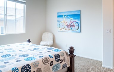 7366 Solstice Place Rancho Cucamonga, CA 91739 - Photo 13 of 32 a bedroom with a bed and a painting on the wall