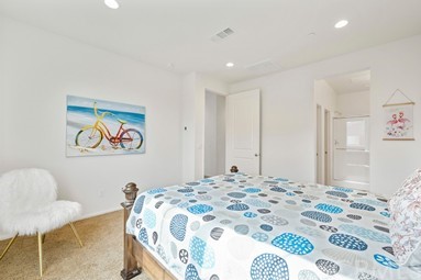 7366 Solstice Place Rancho Cucamonga, CA 91739 - Photo 14 of 32 a bedroom with a bed and a painting on the wall