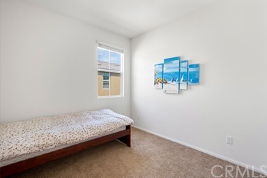 7366 Solstice Place Rancho Cucamonga, CA 91739 - Photo 16 of 32 a bedroom with a bed and a window