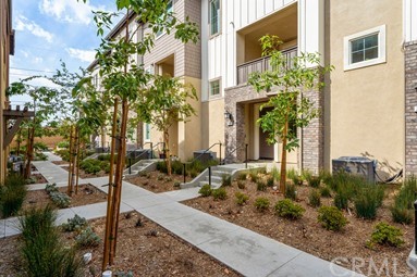 7366 Solstice Place Rancho Cucamonga, CA 91739 - Photo 26 of 32 a front view of a house with garden