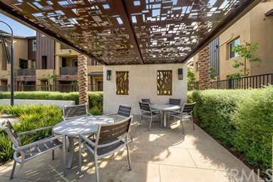 7366 Solstice Place Rancho Cucamonga, CA 91739 - Photo 29 of 32 a view of a patio with table and chairs and potted plants