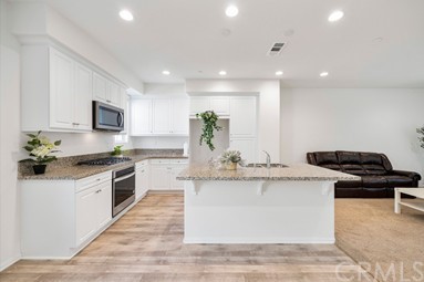 7366 Solstice Place Rancho Cucamonga, CA 91739 - Photo 4 of 32 a bedroom with a bed and a painting on the wall