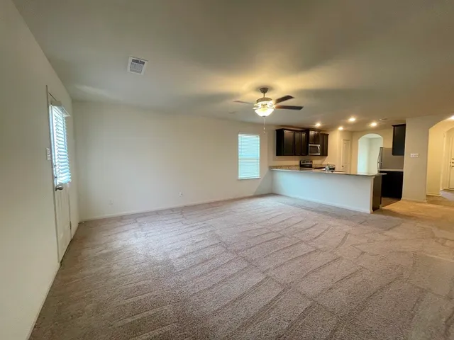 a view of a kitchen and a window