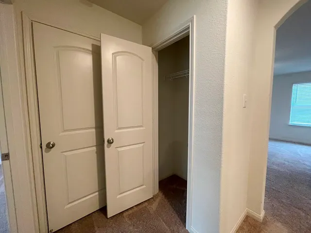 a view of a bathroom with closet area