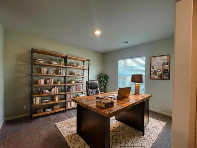a view of a workspace with furniture