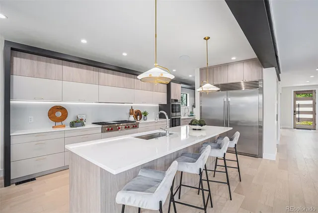 a kitchen with a dining table and chairs