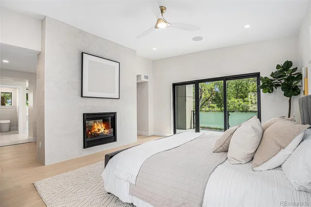 a bedroom with a bed and a fireplace