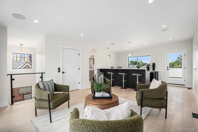 a living room with furniture and a table