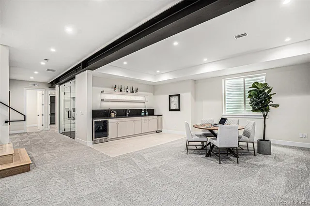 a kitchen with stainless steel appliances a sink and cabinets