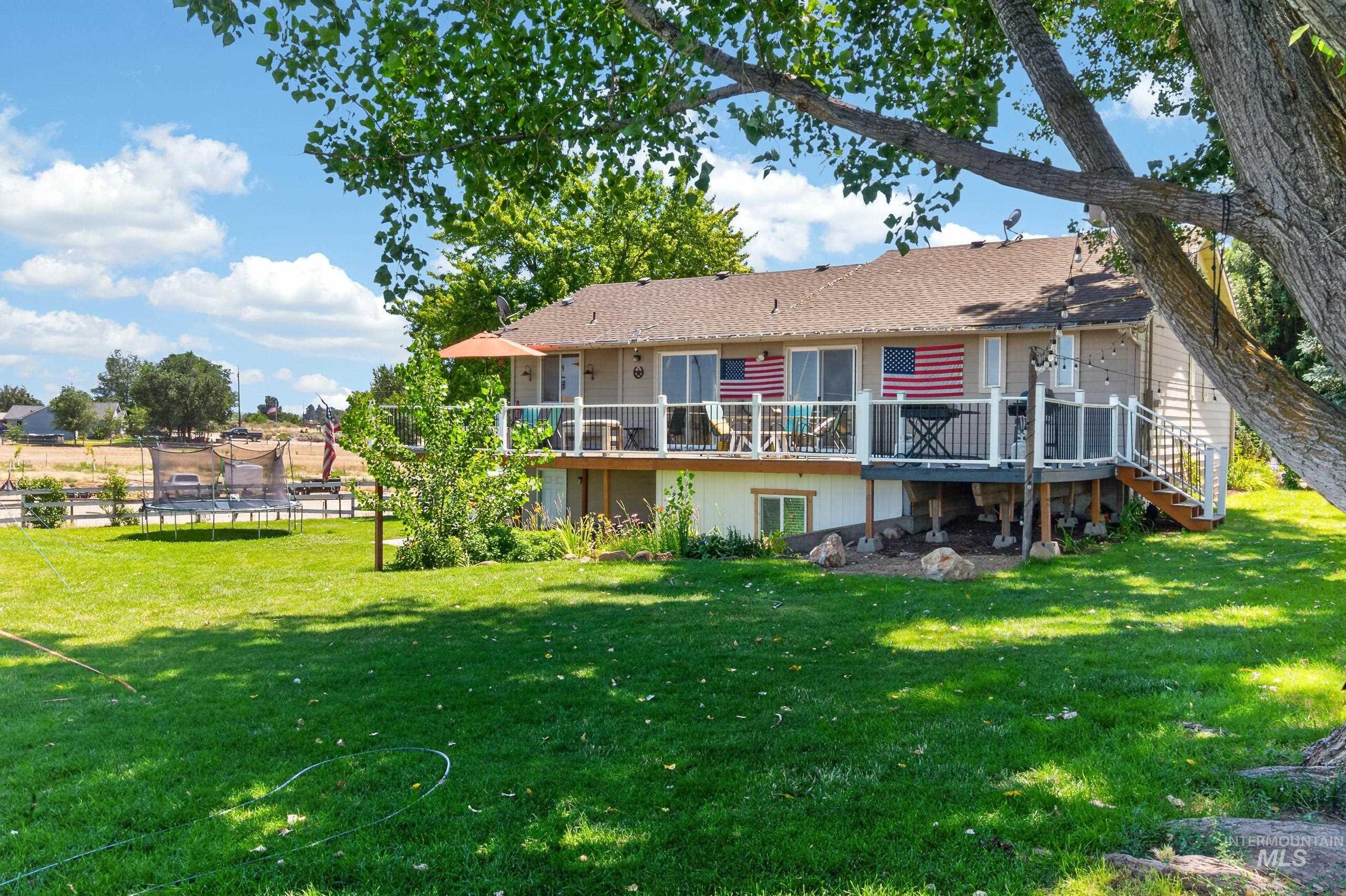 9696 Gloria Road Middleton, ID 83644 - Photo 45 of 50 Expansive green lawn with mature shade trees