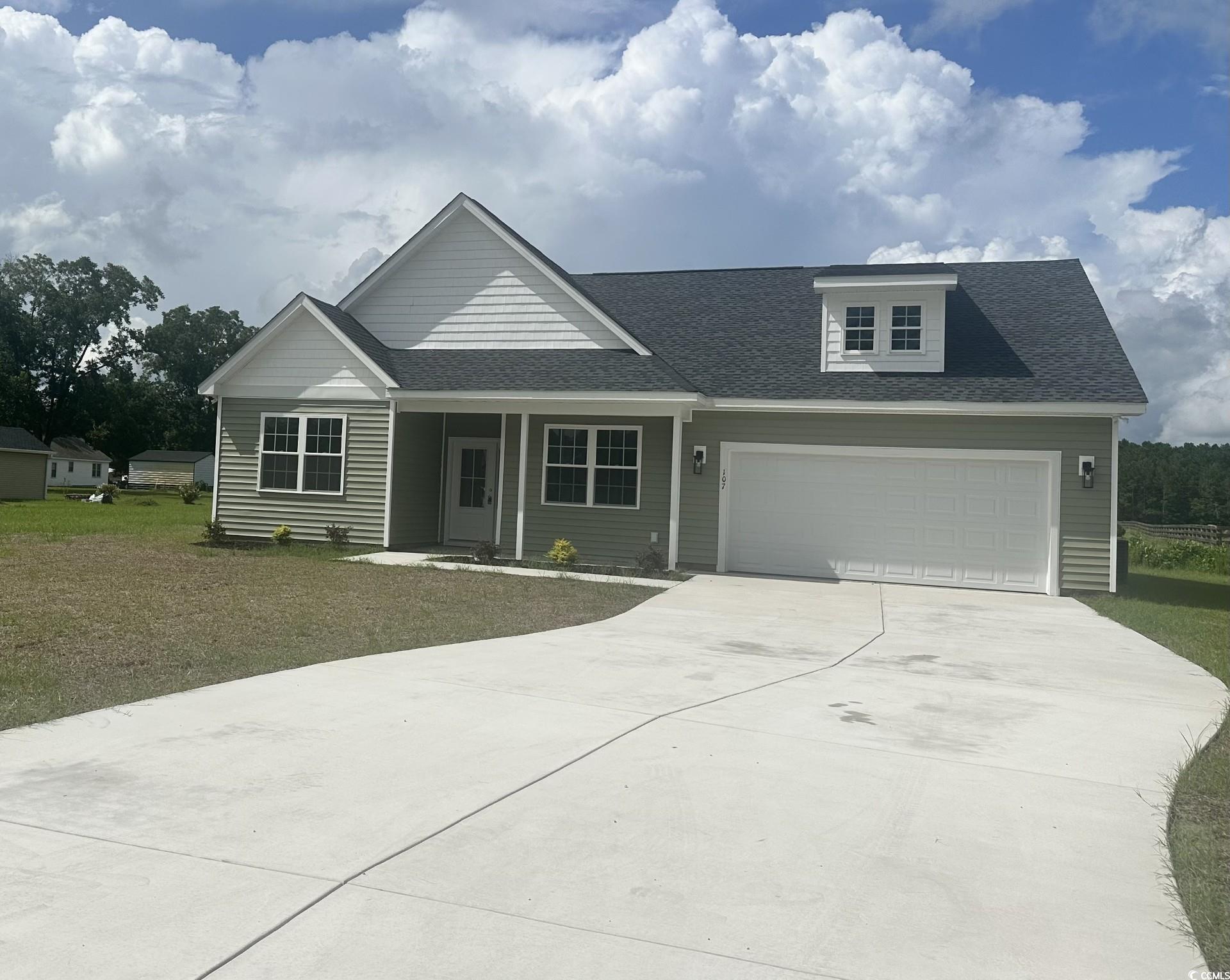 107 Infinity Lane Loris, SC 29569 - Photo 1 of 31 View of front facade with concrete driveway, cover