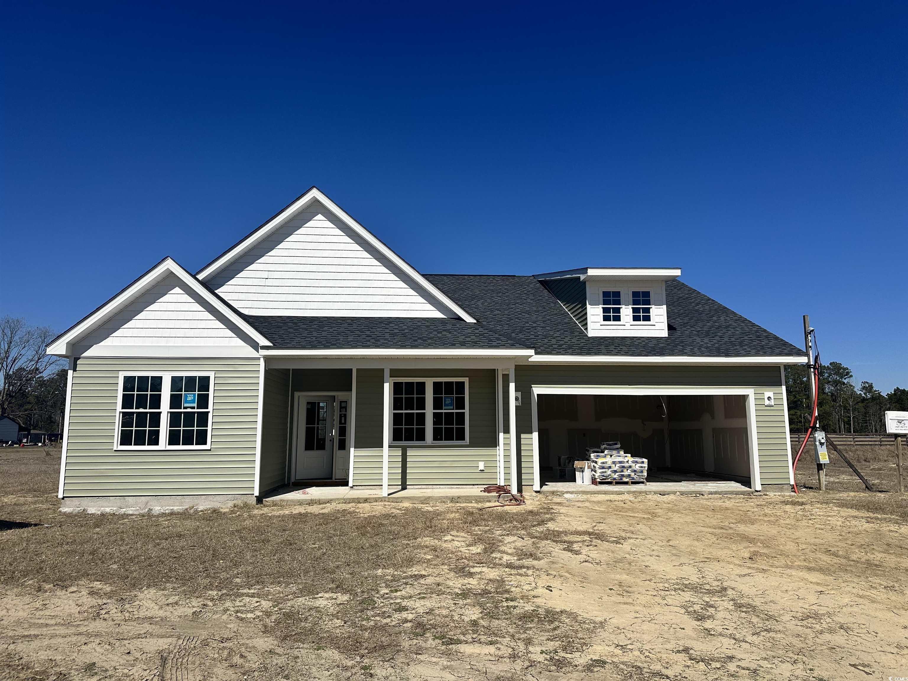 107 Infinity Lane Loris, SC 29569 - Photo 2 of 31 View of front of house with a shingled roof, drive