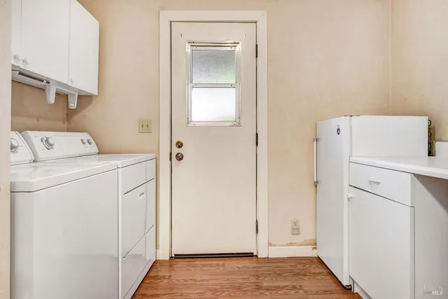 a view of storage and utility room with washer and dryer