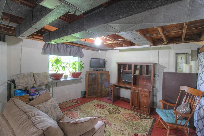 2014 Clayton Road Beaver Falls, PA 15010 - Photo 20 of 24 Lower Level is neat and clean and filled with natural light. Made a great gathering space and office for current owner and family.