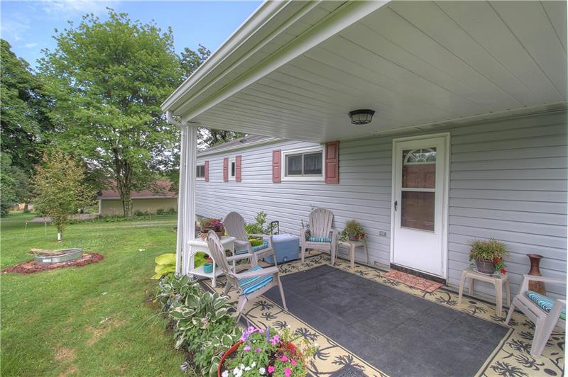 2014 Clayton Road Beaver Falls, PA 15010 - Photo 3 of 24 Cozy covered rear patio beckons you to relax with your favorite beverage!