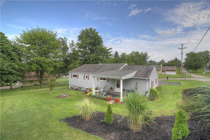 2014 Clayton Road Beaver Falls, PA 15010 - Photo 24 of 24 View from the rear, right angle. Good to know there is also a drainage system in place to keep the interior dry. Gather around the fire pit at night or lounge on the back patio!