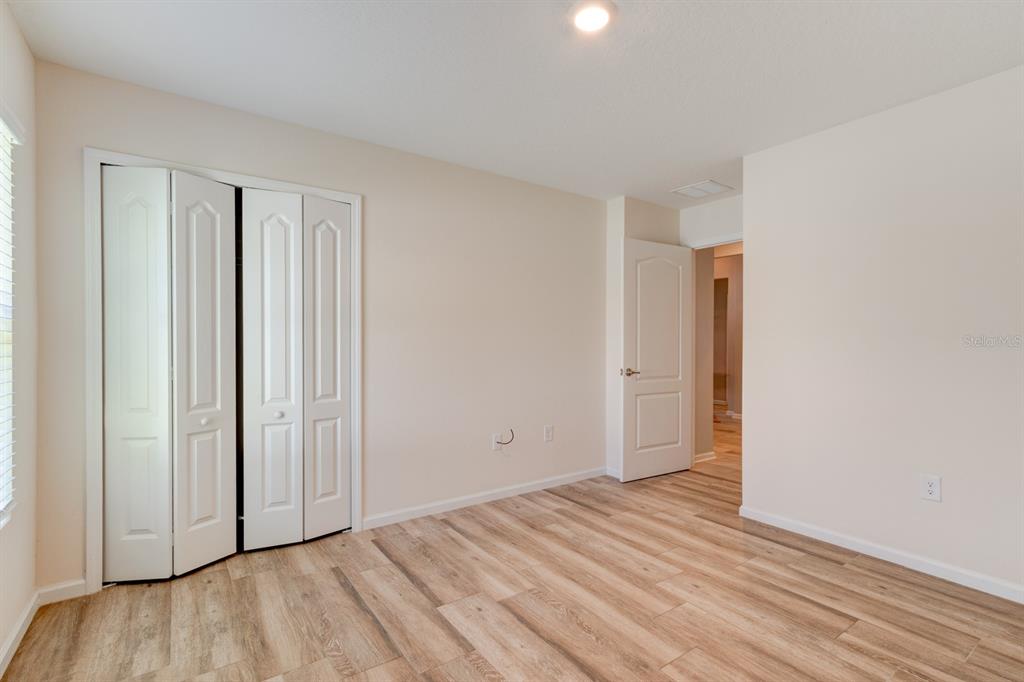9 Ace Court Bunnell, FL 32110 - Photo 19 of 51 a view of empty room with wooden floor