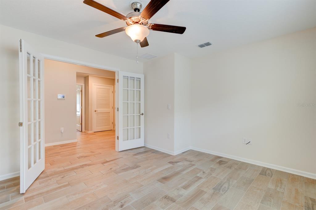 9 Ace Court Bunnell, FL 32110 - Photo 21 of 51 an empty room with fan and entrance