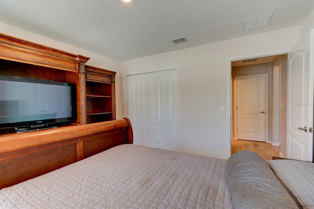 9 Ace Court Bunnell, FL 32110 - Photo 23 of 51 a room with furniture and flat screen tv