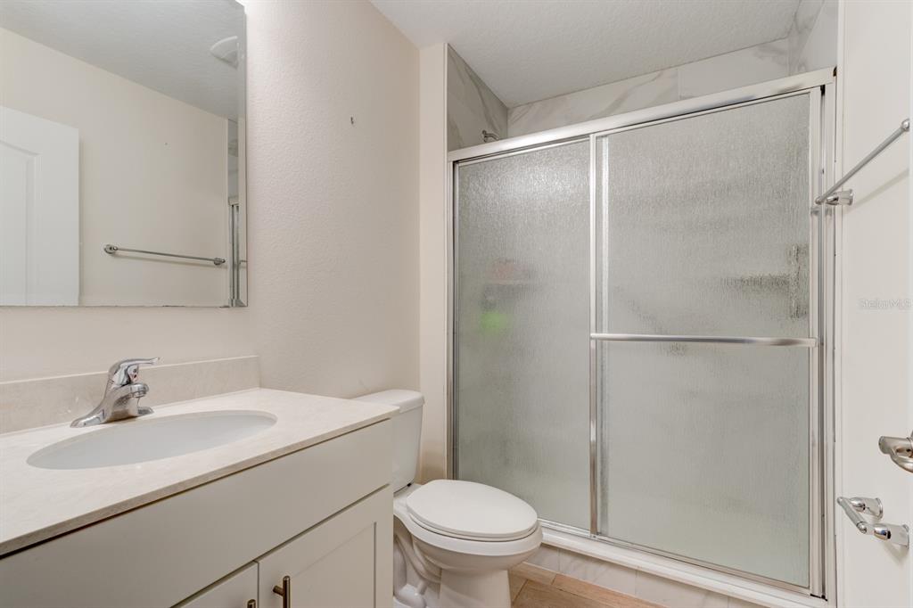 9 Ace Court Bunnell, FL 32110 - Photo 24 of 51 a bathroom with a sink toilet and shower