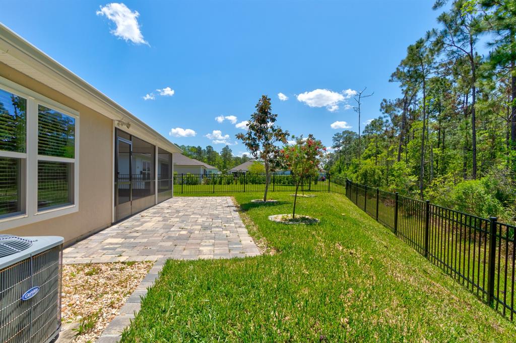 9 Ace Court Bunnell, FL 32110 - Photo 29 of 51 a view of a porch and garden