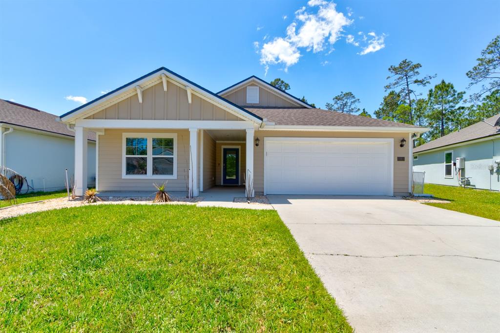 9 Ace Court Bunnell, FL 32110 - Photo 3 of 51 a front view of a house with yard