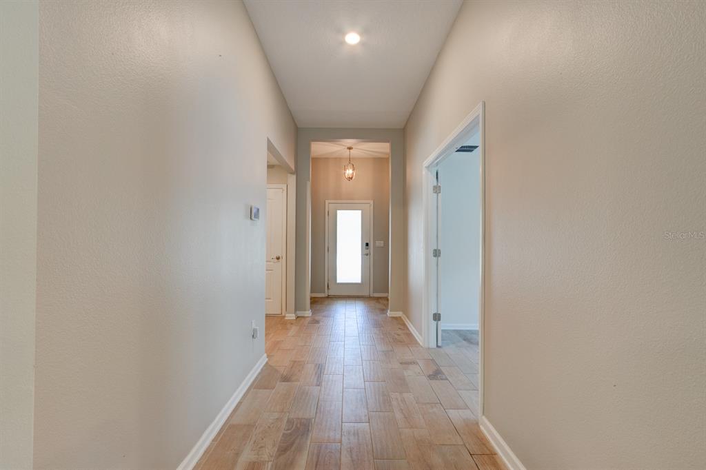 9 Ace Court Bunnell, FL 32110 - Photo 4 of 51 a view of a hallway with wooden floor