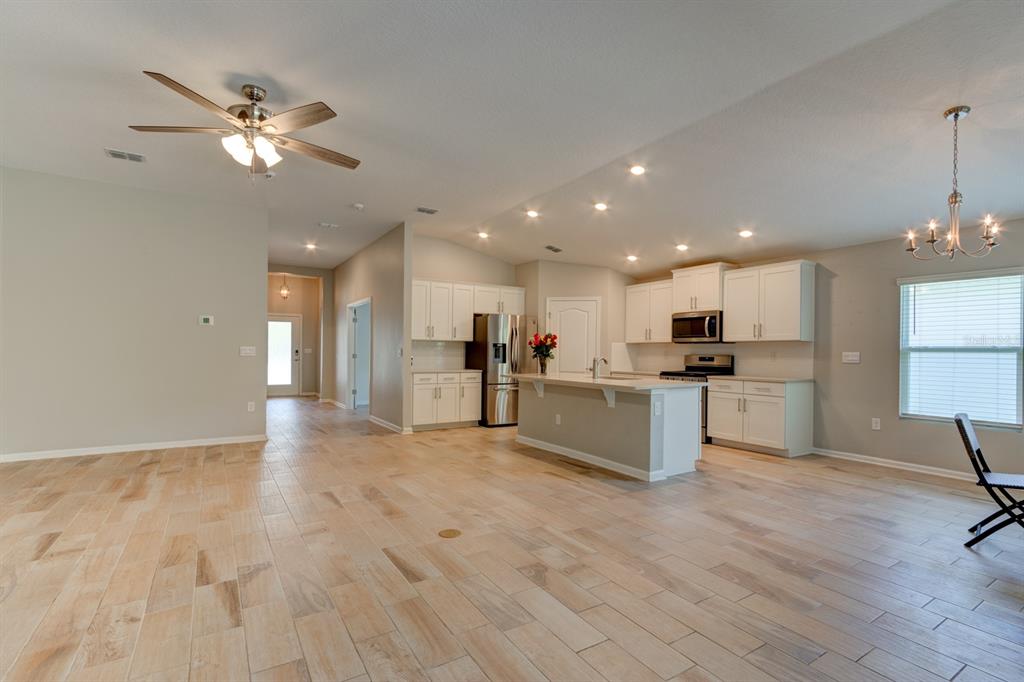 9 Ace Court Bunnell, FL 32110 - Photo 5 of 51 a view of kitchen with cabinets microwave and stove