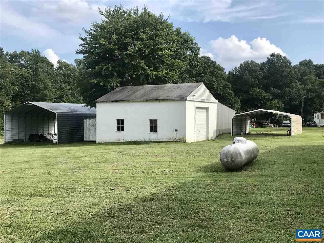 294 Chopping Road Mineral, VA 23117 - Photo 21 of 32 a front view of a house with a garden and trees