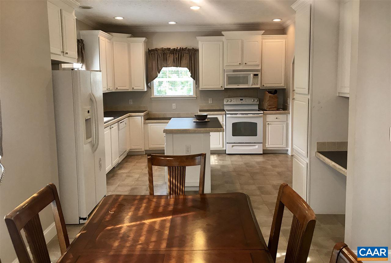 294 Chopping Road Mineral, VA 23117 - Photo 4 of 32 a kitchen with stainless steel appliances a stove a refrigerator and a dining table