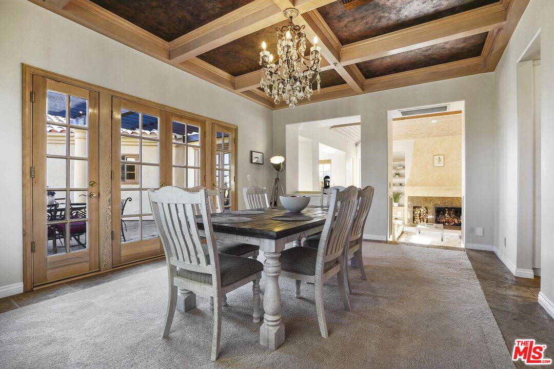 19 Ranchero Road Bell Canyon, CA 91307 - Photo 13 of 42 a view of a dining room with furniture chandelier and a large window
