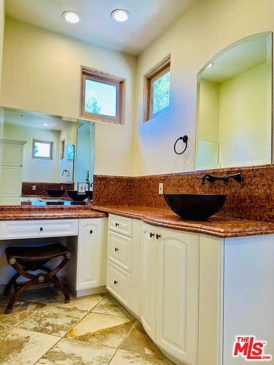 19 Ranchero Road Bell Canyon, CA 91307 - Photo 25 of 42 a kitchen with stainless steel appliances a sink and a counter top space