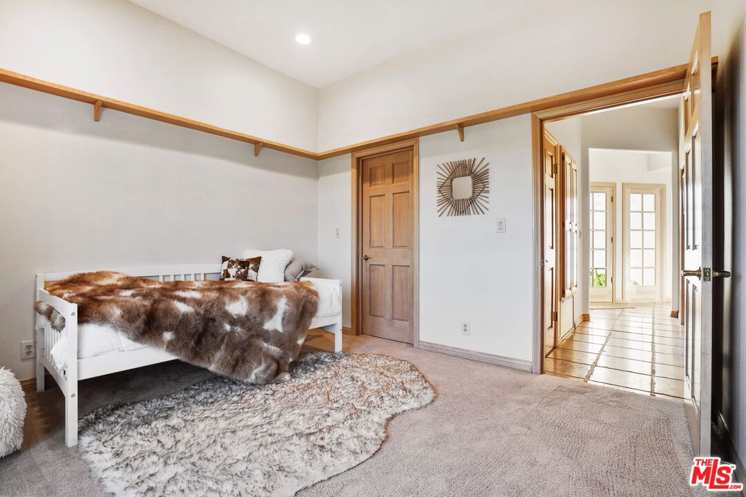 19 Ranchero Road Bell Canyon, CA 91307 - Photo 28 of 42 a bedroom with a bed and wooden floor