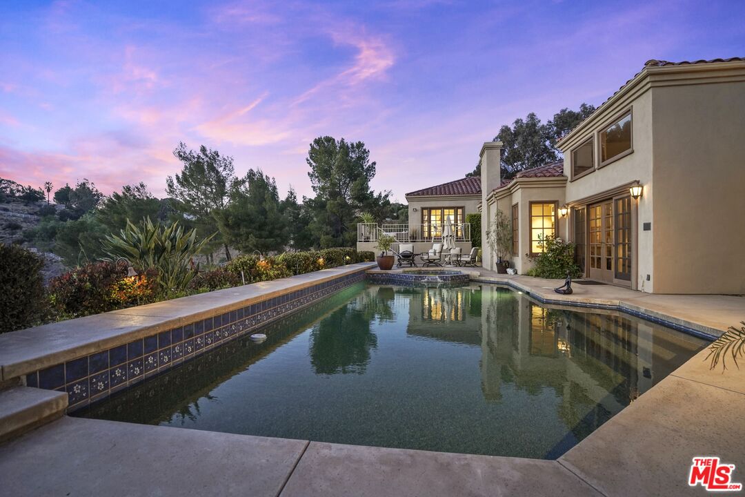 19 Ranchero Road Bell Canyon, CA 91307 - Photo 3 of 42 a view of a swimming pool with a yard