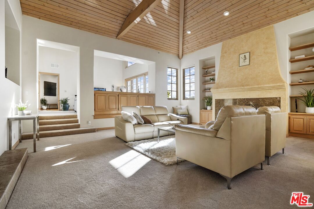 19 Ranchero Road Bell Canyon, CA 91307 - Photo 7 of 42 a living room with furniture and a chandelier