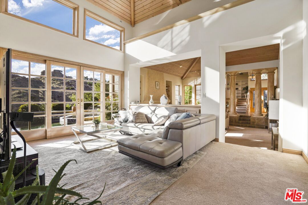19 Ranchero Road Bell Canyon, CA 91307 - Photo 9 of 42 a living room with furniture and a large window