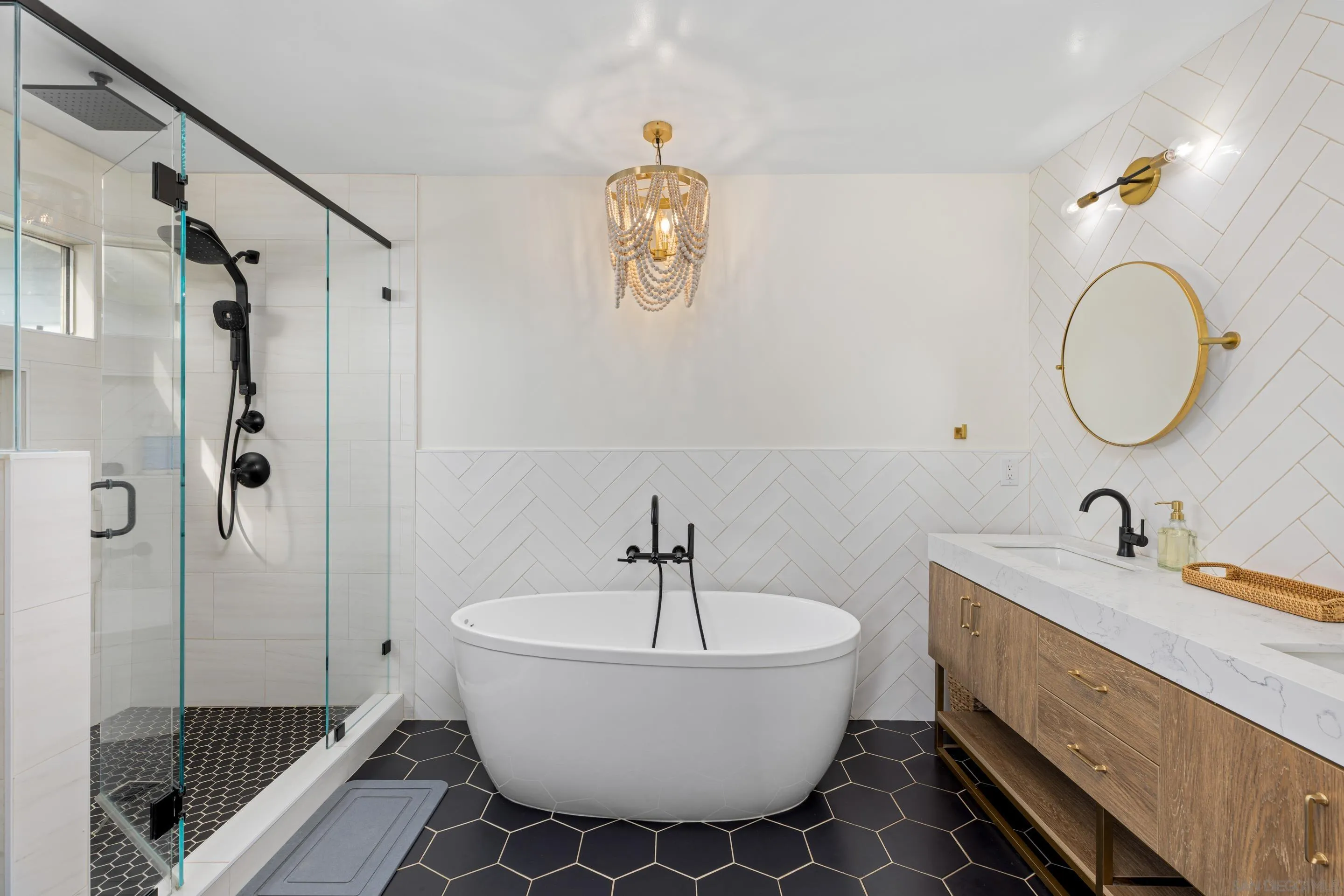 579 Hygeia Avenue, Unit A Encinitas, CA 92024 - Photo 11 of 25 a bathroom with a sink and a mirror