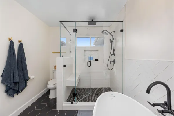 a bathroom with a sink toilet and shower