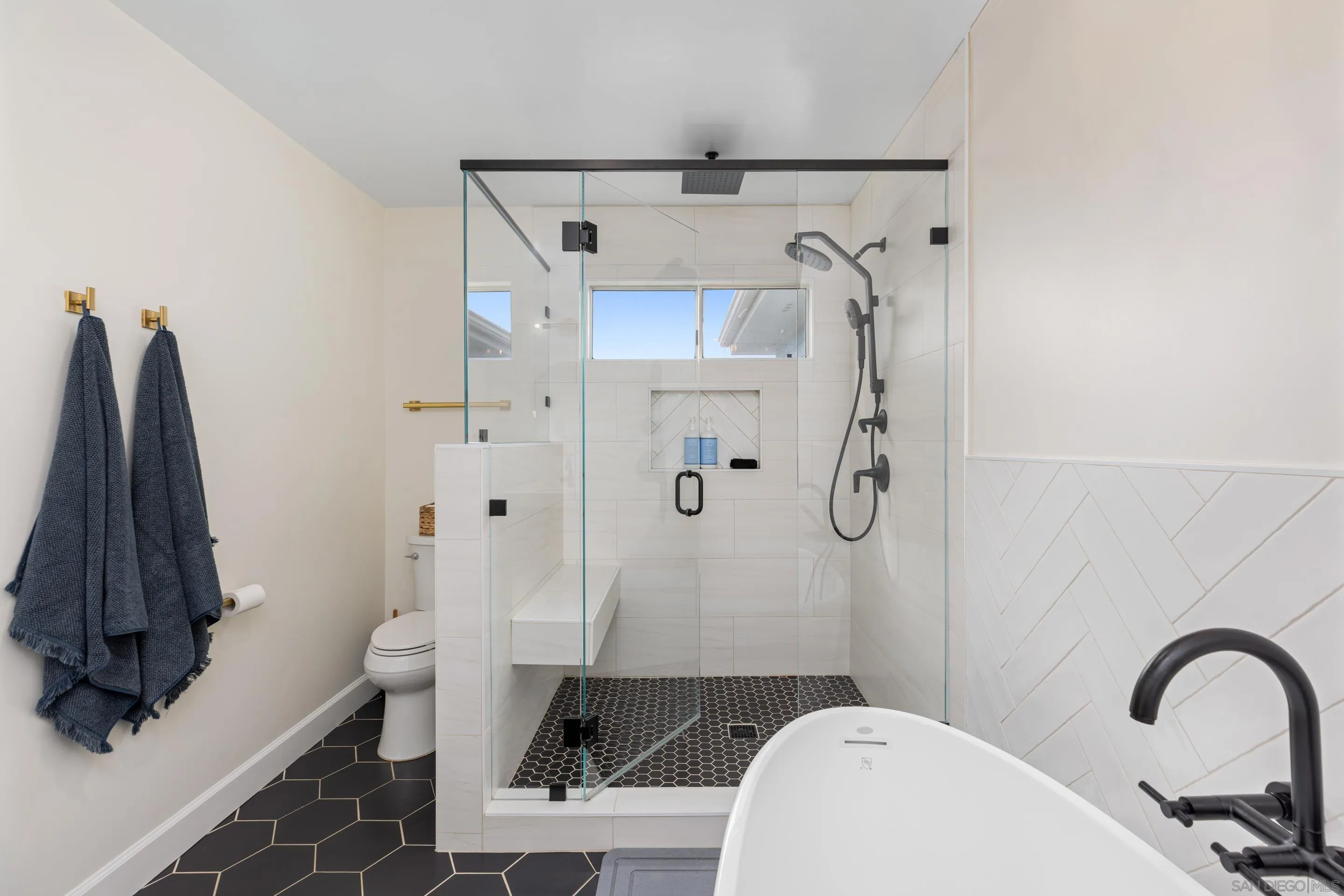 579 Hygeia Avenue, Unit A Encinitas, CA 92024 - Photo 12 of 25 a bathroom with a sink toilet and shower