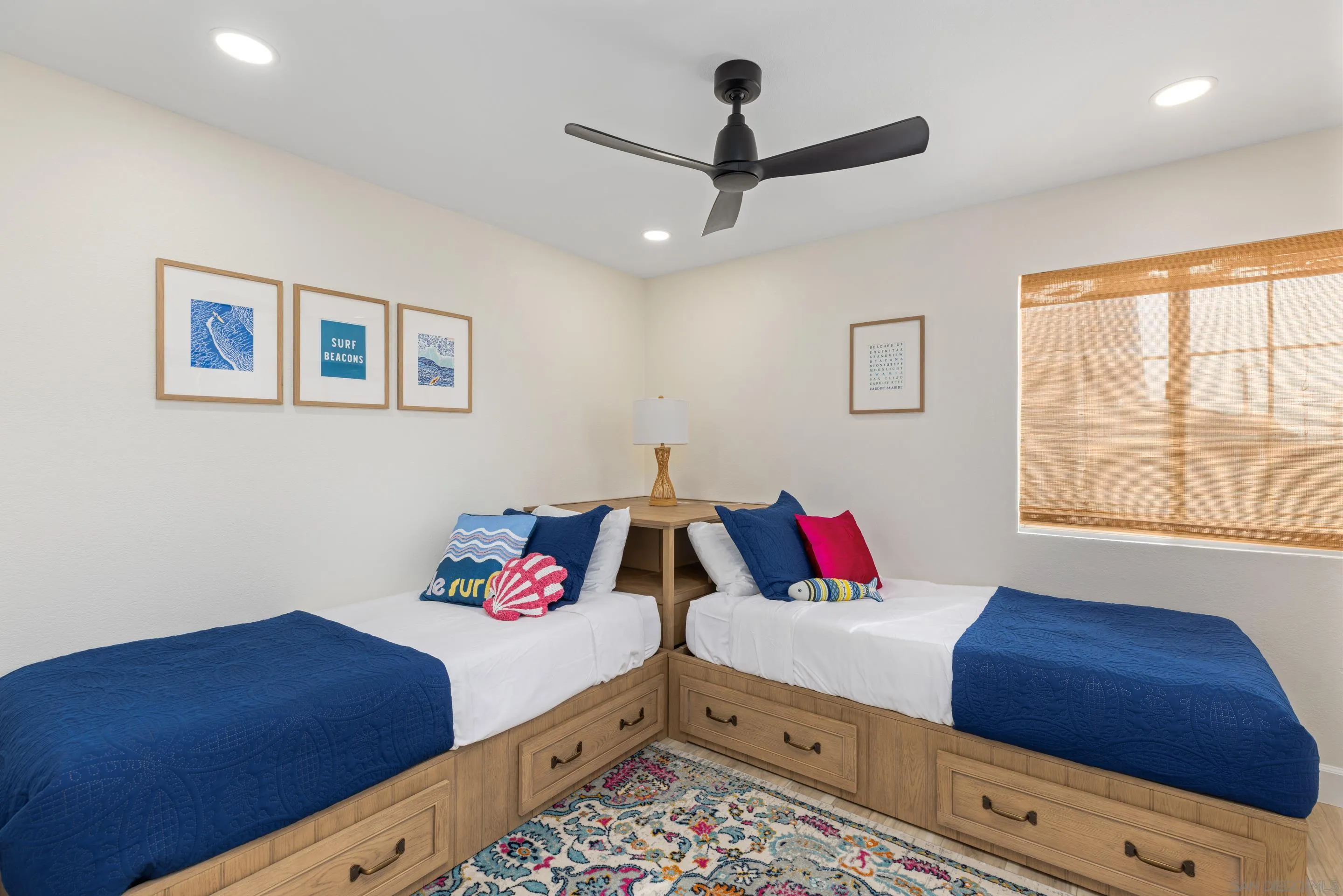 579 Hygeia Avenue, Unit A Encinitas, CA 92024 - Photo 17 of 25 a bedroom with a bed and a dresser next to a window