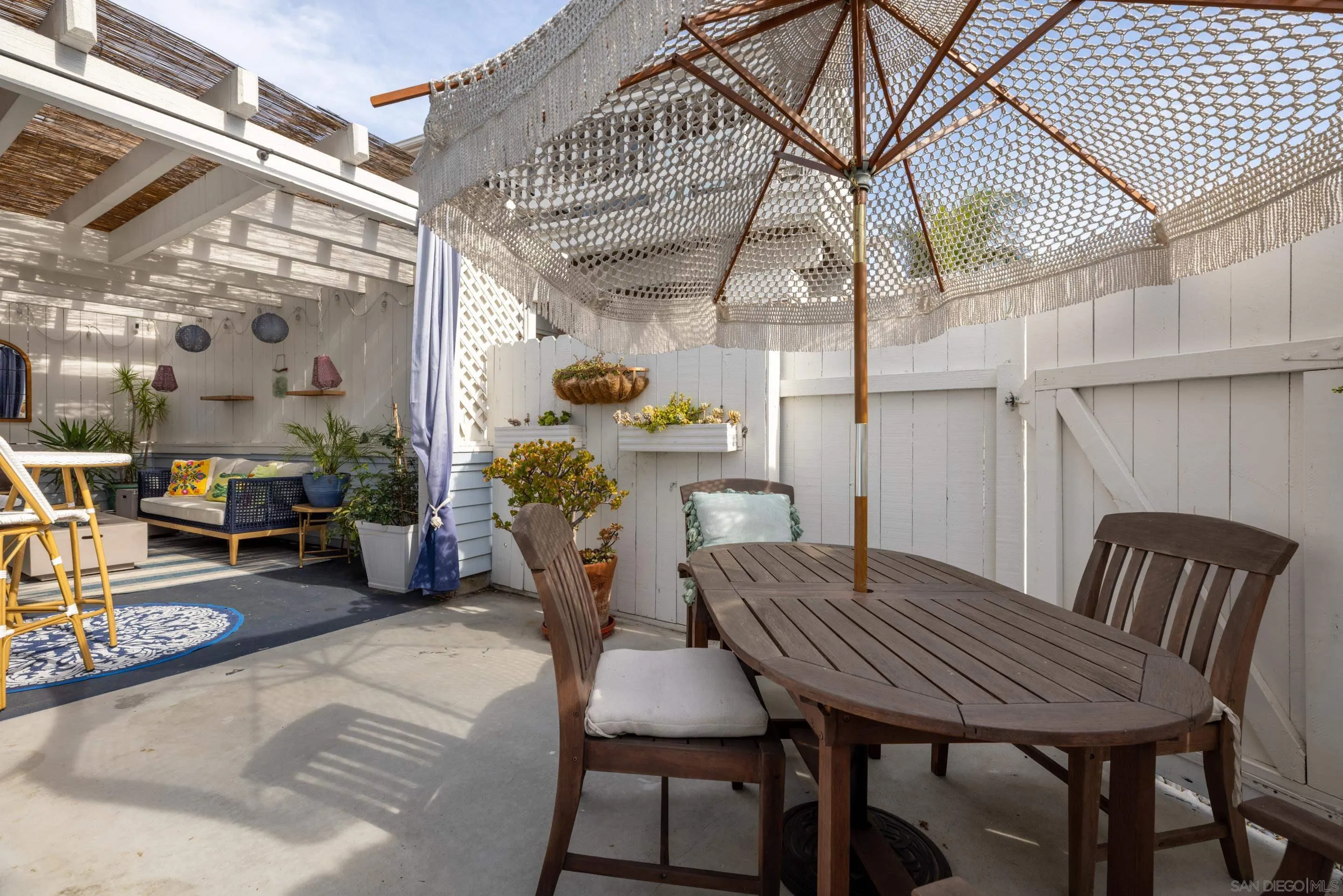 579 Hygeia Avenue, Unit A Encinitas, CA 92024 - Photo 23 of 25 a view of a chairs and table in the patio