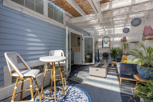 a patio with a table and chairs