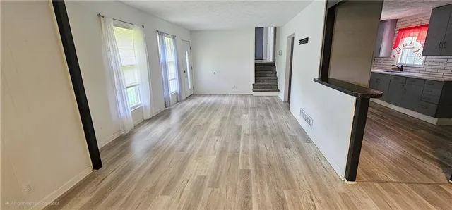 a view of front door with wooden floor
