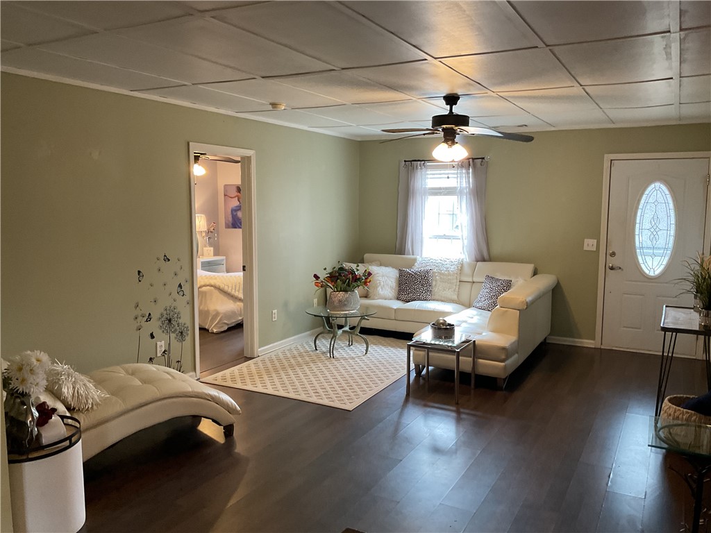 229 Cub Cove Drive Walhalla, SC 29691 - Photo 12 of 50 This inviting living area features warm wood flooring and abundant natural light.
