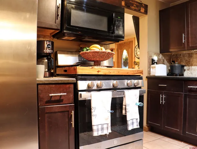 a kitchen with a stove and a microwave
